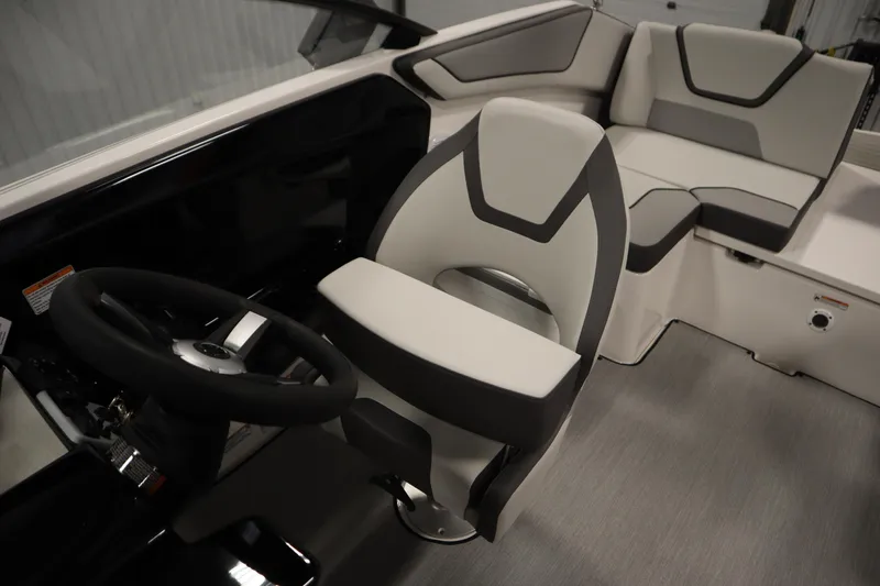 Slide: The Image of 2026 Yamaha Boats SX220 interior with modern seating and steering wheel design. - 26