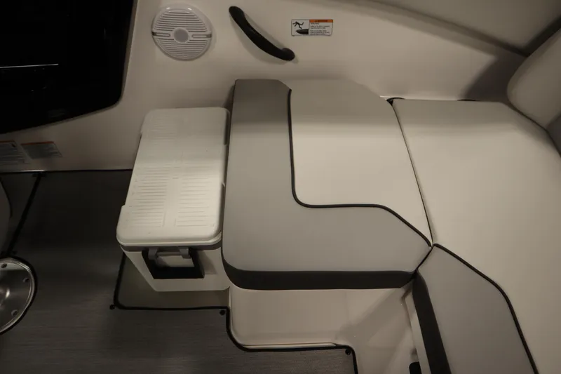 Slide: The Image of 2026 Yamaha Boats SX220 interior seating with storage compartment and speaker. - 34