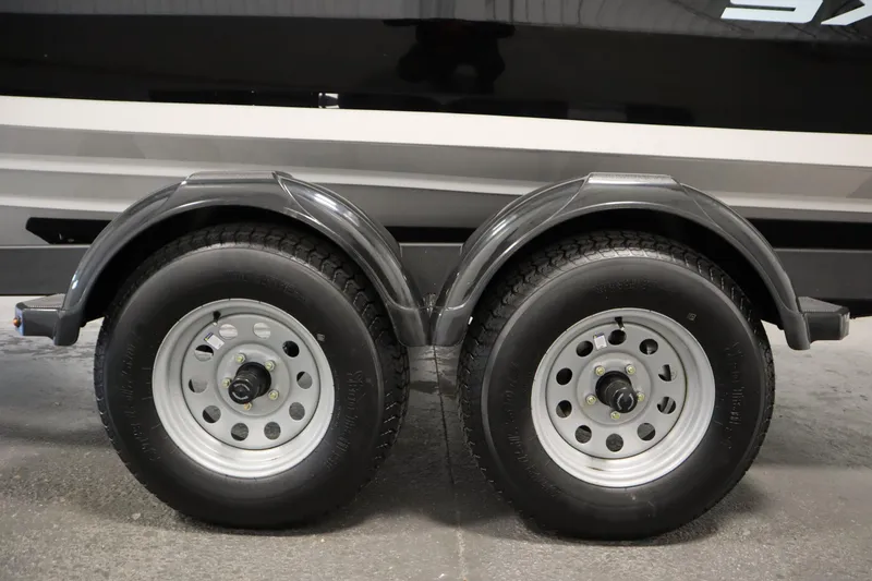 Slide: The Image of Trailer wheels of a 2026 Yamaha Boats SX220, showcasing dual tire setup. - 41