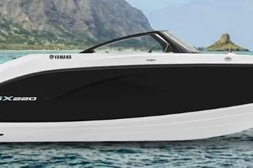 Slide: The Image of 2026 Yamaha Boats SX220 on scenic water with mountainous backdrop. - 42