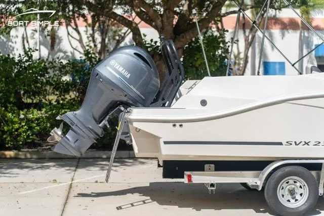 Slide: The Image of 2023 Starcraft SVX 231 OB DH boat with Yamaha outboard motor on trailer. - 5