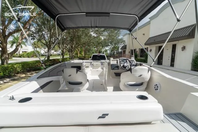 Slide: The Image of 2023 Starcraft SVX 231 OB DH boat interior with seating and steering wheel. - 15