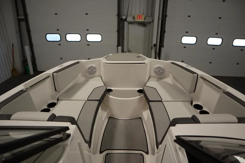Slide: The Image of 2026 Yamaha Boats SX220 in a garage, showcasing sleek design and modern features. - 10
