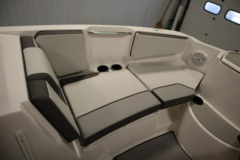 Slide: The Image of 2026 Yamaha Boats SX220 bow storage with stainless steel ladder and speakers. - 13