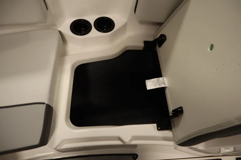 Slide: The Image of Open storage compartment on 2026 Yamaha Boats SX220, showcasing interior space. - 16