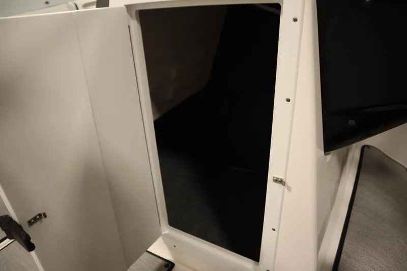 Slide: The Image of 2026 Yamaha Boats SX220 interior seating with speaker and cup holder. - 18