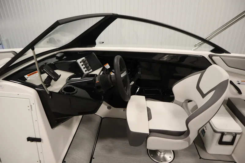 Slide: The Image of 2026 Yamaha Boats SX220 interior seating with cup holders, featuring modern design and comfort. - 19