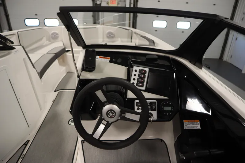 Slide: The Image of 2026 Yamaha Boats SX220 cockpit with modern steering and control panel. - 20