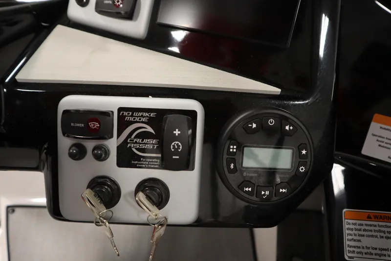 Slide: The Image of Control panel of 2026 Yamaha Boats SX220 featuring cruise assist and no wake mode. - 24