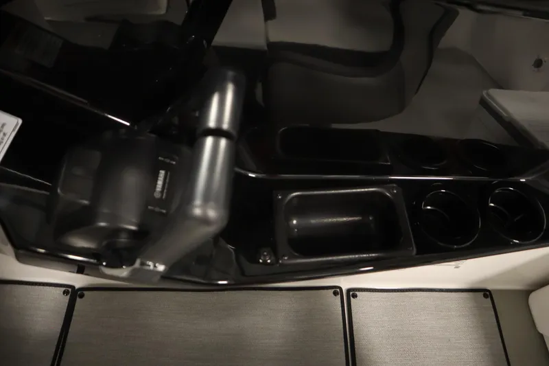Slide: The Image of 2026 Yamaha Boats SX220 interior with modern seating and steering wheel. - 25