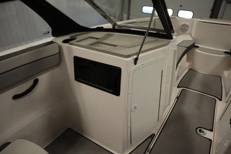 Slide: The Image of 2026 Yamaha Boats SX220 interior with sleek flooring and storage compartments. - 30