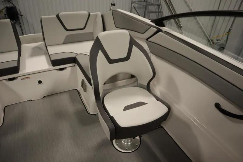 Slide: The Image of 2026 Yamaha Boats SX220 interior with wireless charging pad and cup holder. - 33