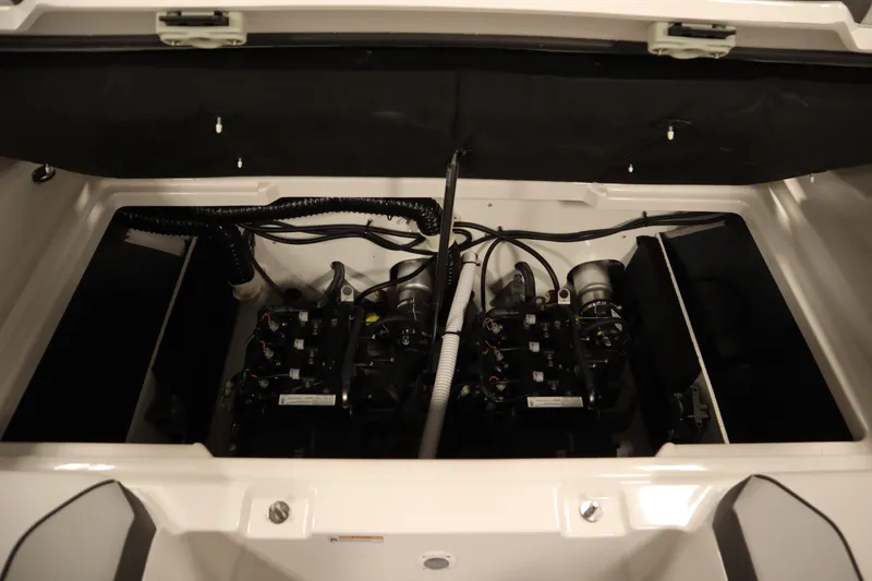 Slide: The Image of 2026 Yamaha Boats SX220 interior with open storage compartment and sleek design. - 36