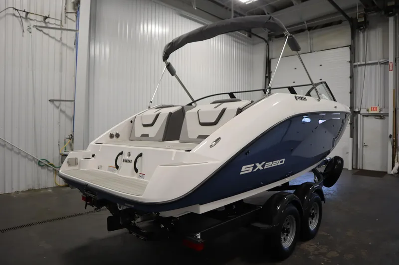 Slide: The Image of 2026 Yamaha Boats SX220 on trailer in indoor storage facility. - 4