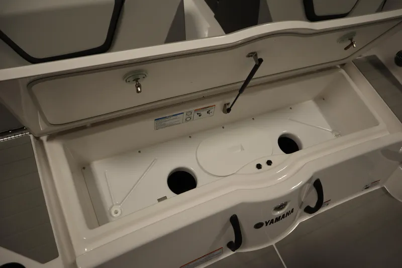 Slide: The Image of 2026 Yamaha Boats SX220 interior seating with integrated cooler and speaker. - 40