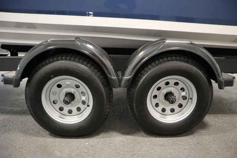 Slide: The Image of 2026 Yamaha Boats SX220 trailer hitch and bow detail in a garage setting. - 45