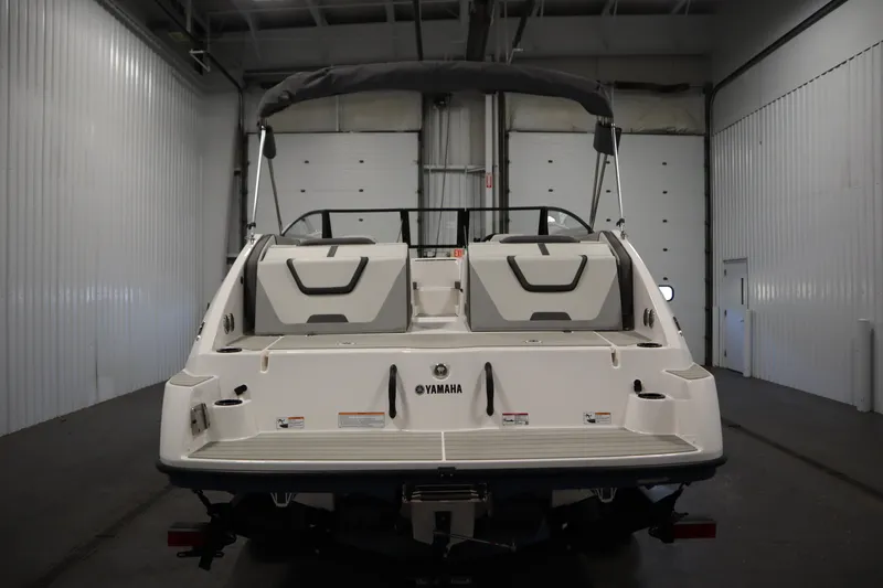 Slide: The Image of 2026 Yamaha Boats SX220 in a garage, showcasing sleek design and modern features. - 5
