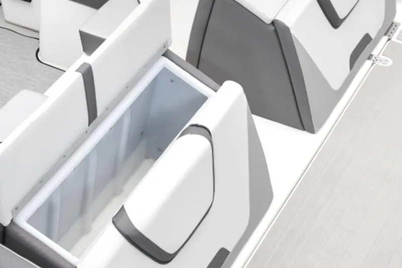 Slide: The Image of 2026 Yamaha Boats SX220 interior storage compartment with sleek white and gray design. - 50