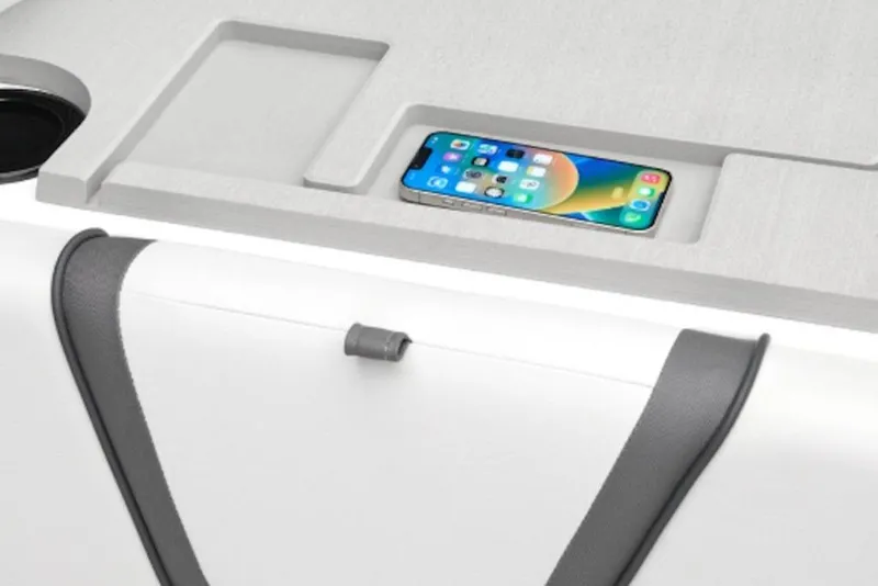 Slide: The Image of 2026 Yamaha Boats SX220 interior with smartphone holder and sleek design. - 52