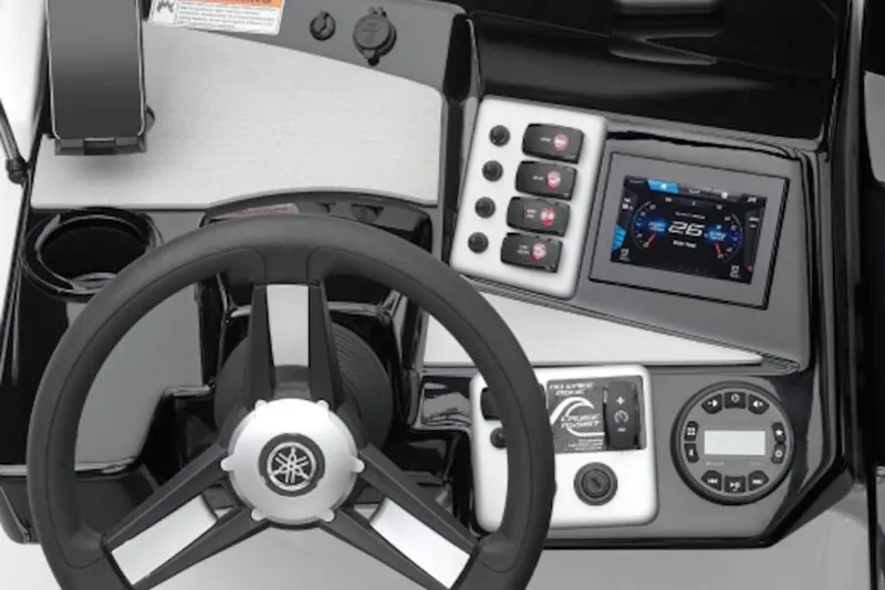 Slide: The Image of 2026 Yamaha Boats SX220 dashboard with steering wheel, digital display, and control panel. - 53