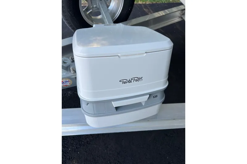 Slide: The Image of Portable Porta Potti 135 on Key West 203 DFS boat trailer, 2022 model. - 14