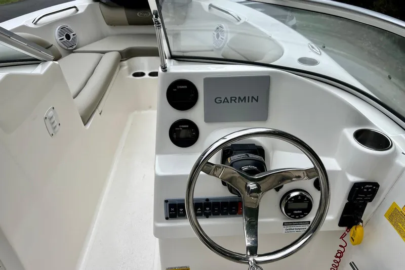 Slide: The Image of 2022 Key West 203 DFS boat dashboard with Garmin navigation system and steering wheel. - 5