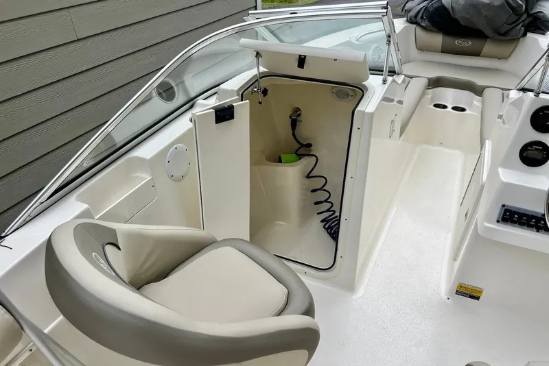 Slide: The Image of 2022 Key West 203 DFS boat interior with seating and storage compartment. - 9