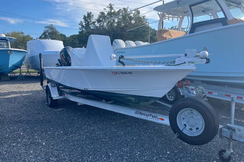 The Image of 2022 Sportsman Masters 207 Bay Boat on trailer, parked outdoors. - 1