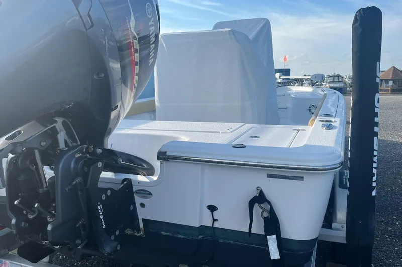 Slide: The Image of 2022 Sportsman Masters 207 Bay Boat with Yamaha engine, docked on a sunny day. - 3