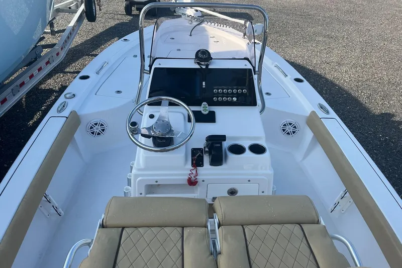 Slide: The Image of 2022 Sportsman Masters 207 Bay Boat interior with steering wheel and control panel. - 6