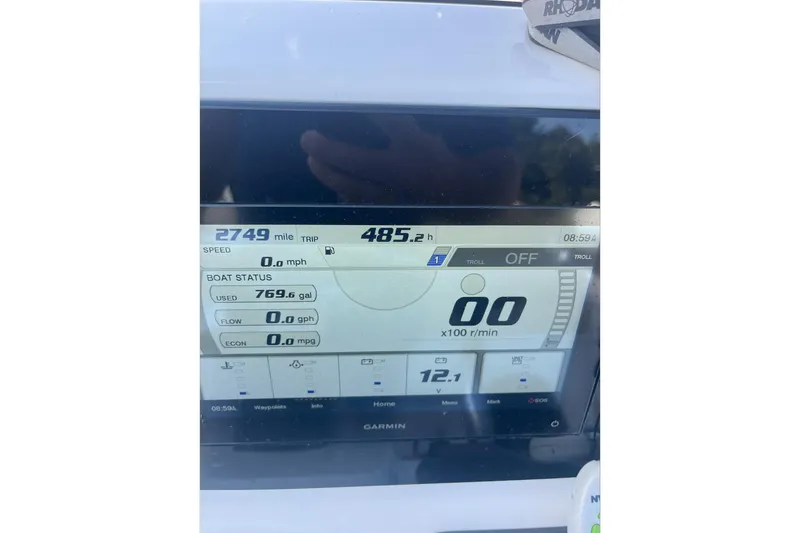 Slide: The Image of Dashboard of 2022 Sportsman Masters 207 Bay Boat showing trip data and fuel usage. - 9