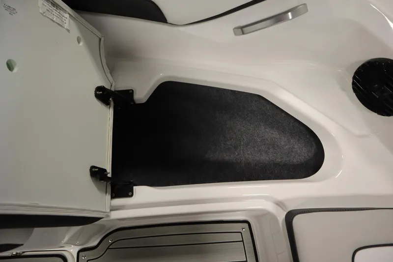 Slide: The Image of Open storage compartment in 2026 Yamaha Boats 195S, featuring sleek interior design. - 12