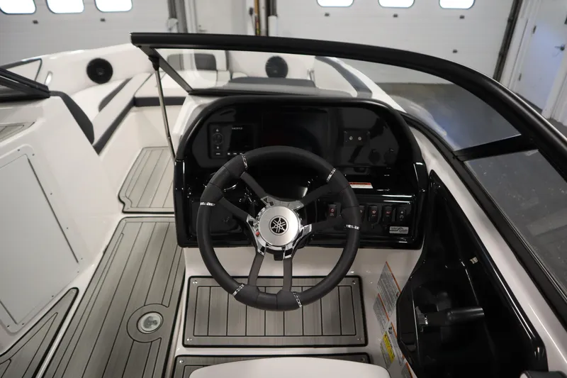 Slide: The Image of 2026 Yamaha Boats 195S cockpit with steering wheel and control panel. - 17