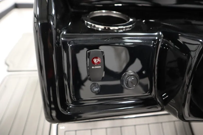 Slide: The Image of Control panel of 2026 Yamaha Boats 195S with blower switch and cup holder. - 20