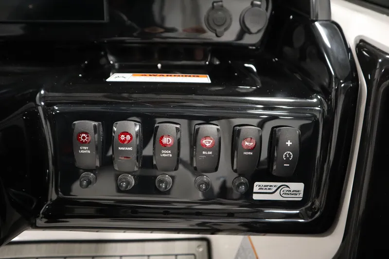 Slide: The Image of Control panel of 2026 Yamaha Boats 195S with various switches and buttons. - 21