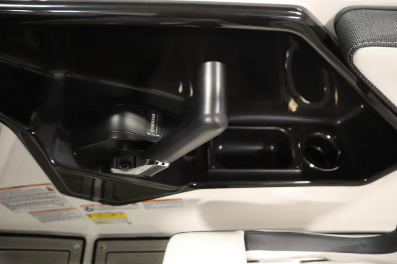 Slide: The Image of Interior view of 2026 Yamaha Boats 195S, featuring sleek black console design. - 22