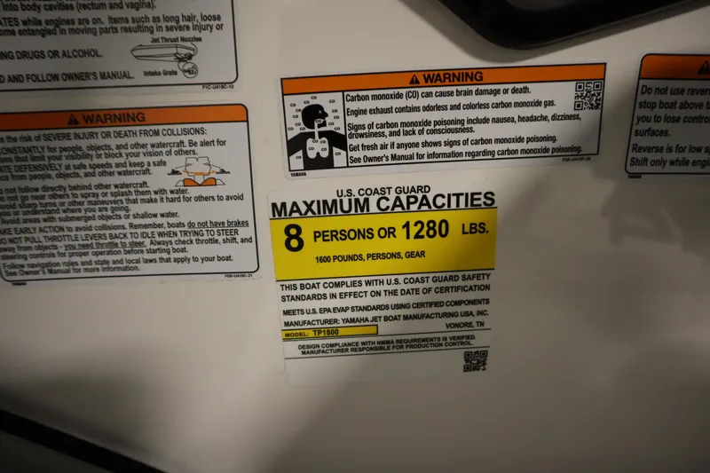 Slide: The Image of Yamaha Boats 195S 2026 capacity label: 8 persons or 1280 lbs, safety warnings included. - 23