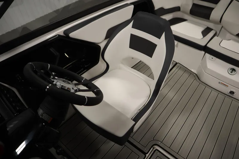 Slide: The Image of 2026 Yamaha Boats 195S interior with sleek steering wheel and modern seating design. - 24