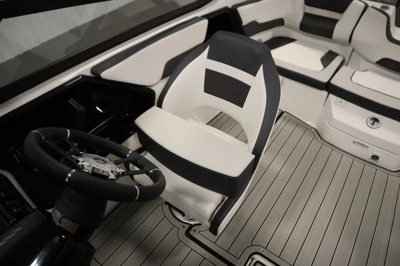 Slide: The Image of 2026 Yamaha Boats 195S interior with sleek steering wheel and modern seating design. - 25