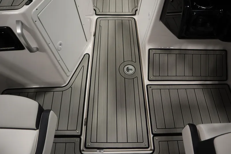 Slide: The Image of 2026 Yamaha Boats 195S interior with sleek, modern flooring and seating design. - 27