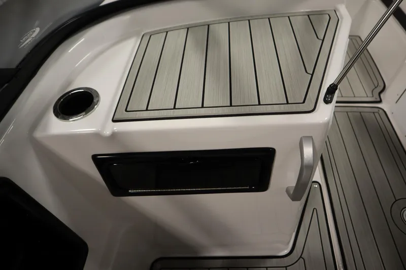 Slide: The Image of 2026 Yamaha Boats 195S interior detail with sleek deck and cup holder. - 30