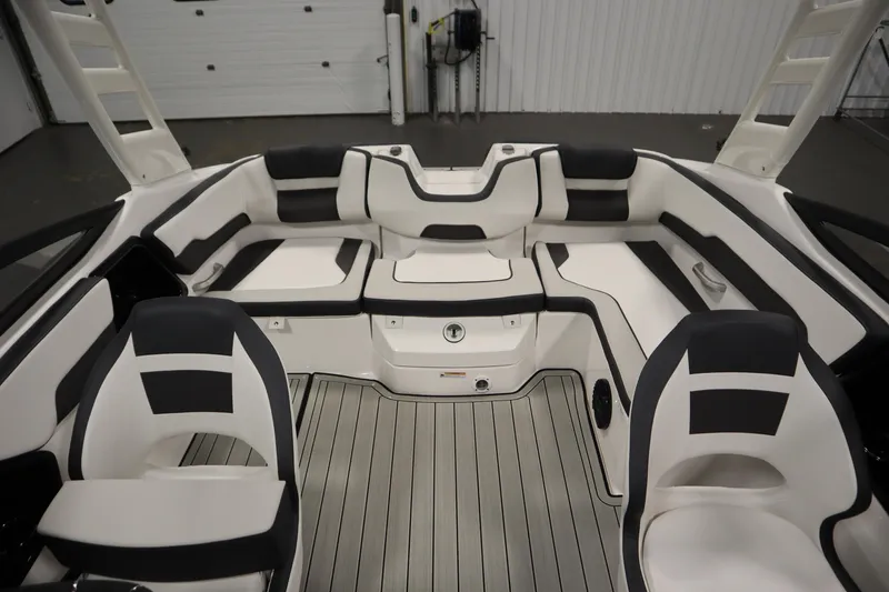 Slide: The Image of 2026 Yamaha Boats 195S interior with sleek black and white seating and modern design. - 33
