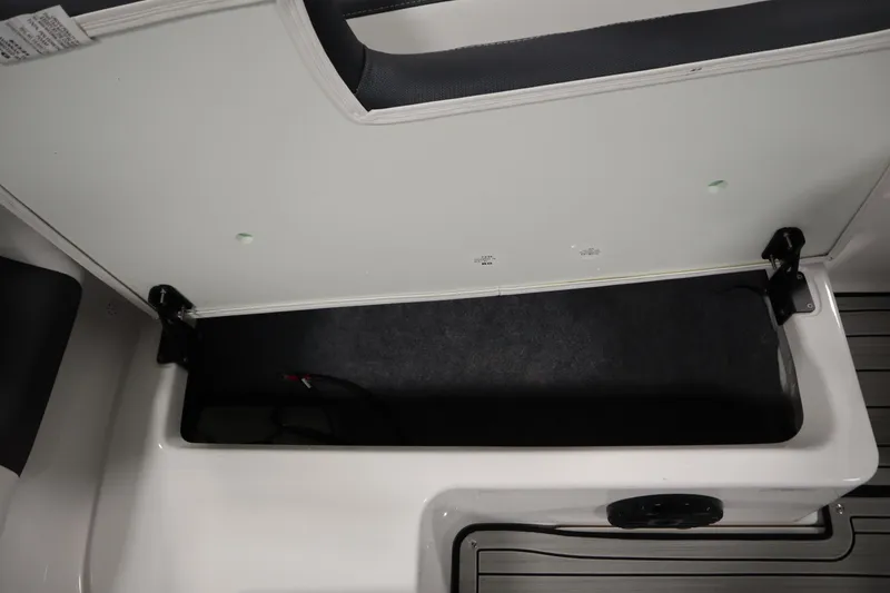 Slide: The Image of Open storage compartment in 2026 Yamaha Boats 195S, showcasing interior space and design. - 35