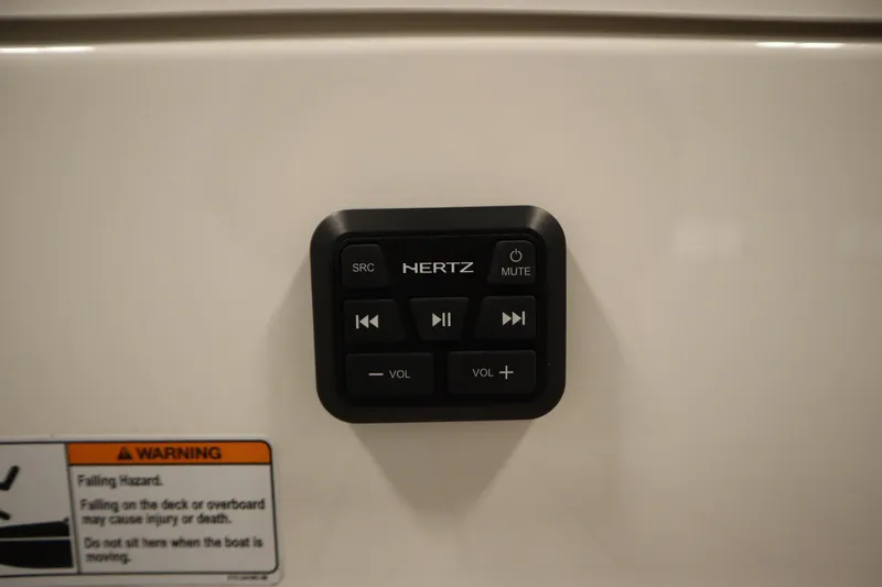 Slide: The Image of Control panel on 2026 Yamaha Boats 195S, featuring audio controls and warning label. - 41