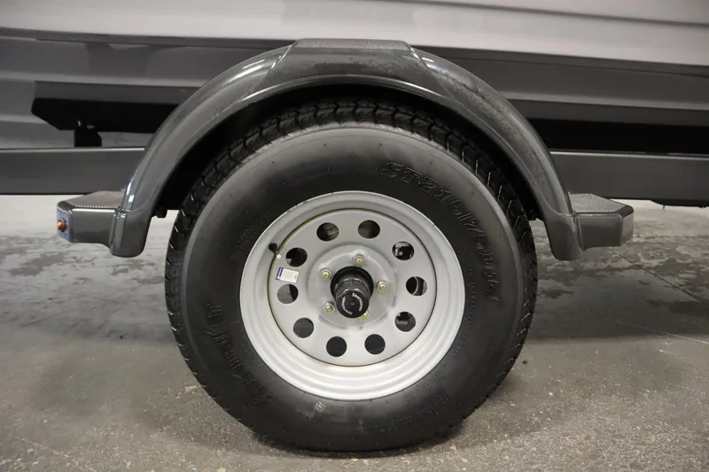 Slide: The Image of 2026 Yamaha Boats 195S trailer wheel with black tire and metal rim. - 45