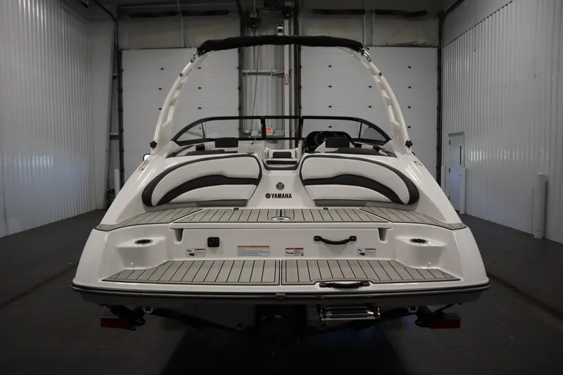 Slide: The Image of 2026 Yamaha Boats 195S, rear view in a garage setting. - 5