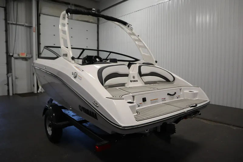 Slide: The Image of 2026 Yamaha Boats 195S in a showroom, showcasing sleek design and modern features. - 6