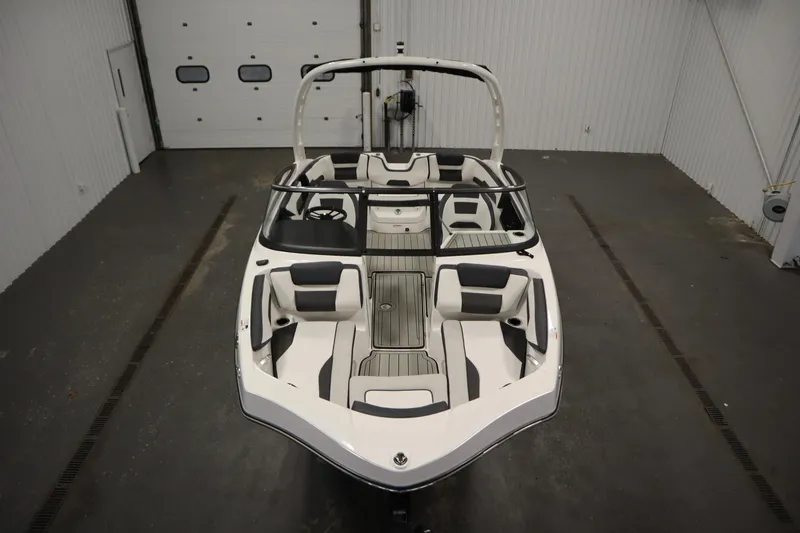 Slide: The Image of 2026 Yamaha Boats 195S in a showroom, showcasing sleek design and spacious seating. - 8