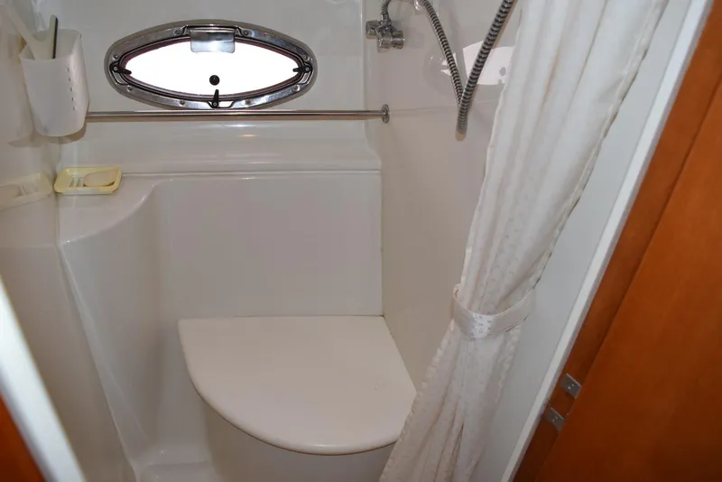Slide: The Image of Shower area in 2001 Carver 444 Cockpit Motor Yacht with curtain and porthole window. - 32