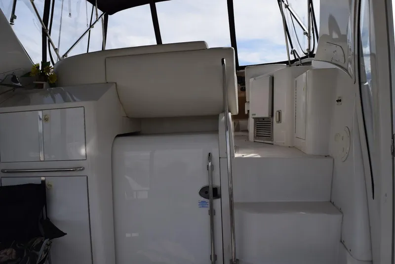 Slide: The Image of 2001 Carver 444 Cockpit Motor Yacht interior with stairs and cabinetry. - 13